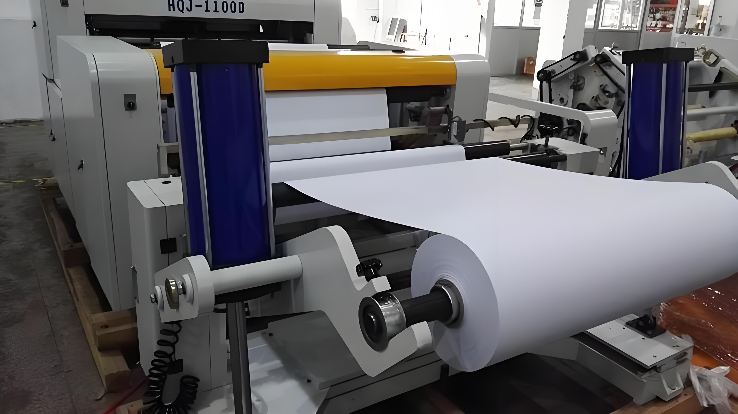 Large paper roll mounted on industrial machinery